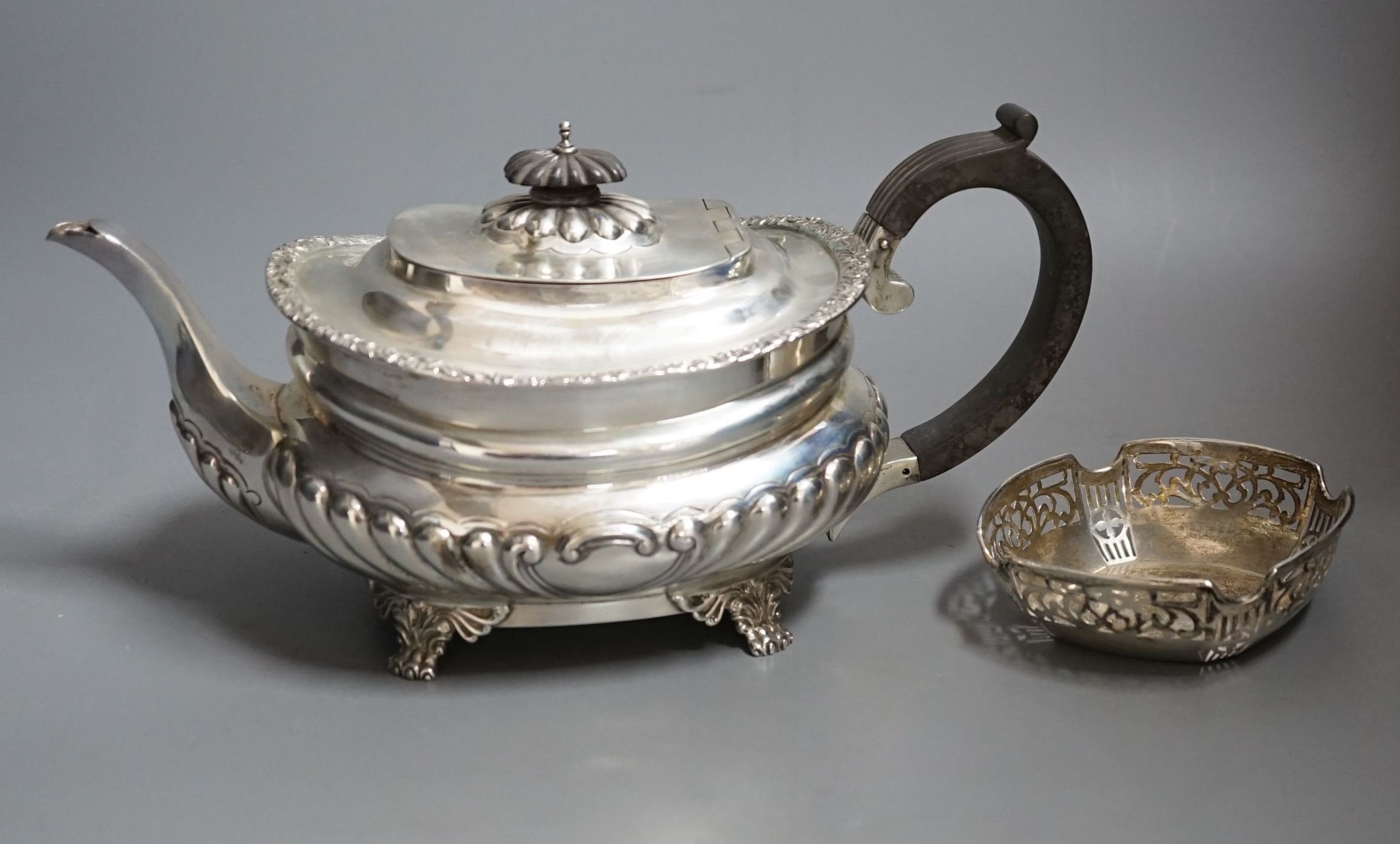 A George V demi-fluted silver teapot, by Charles Stuart Harris & Sons, London, 1928 and a small silver dish